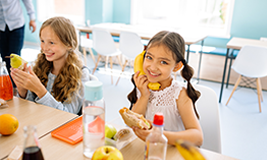 students having meal in class